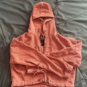 pink cropped zip-up